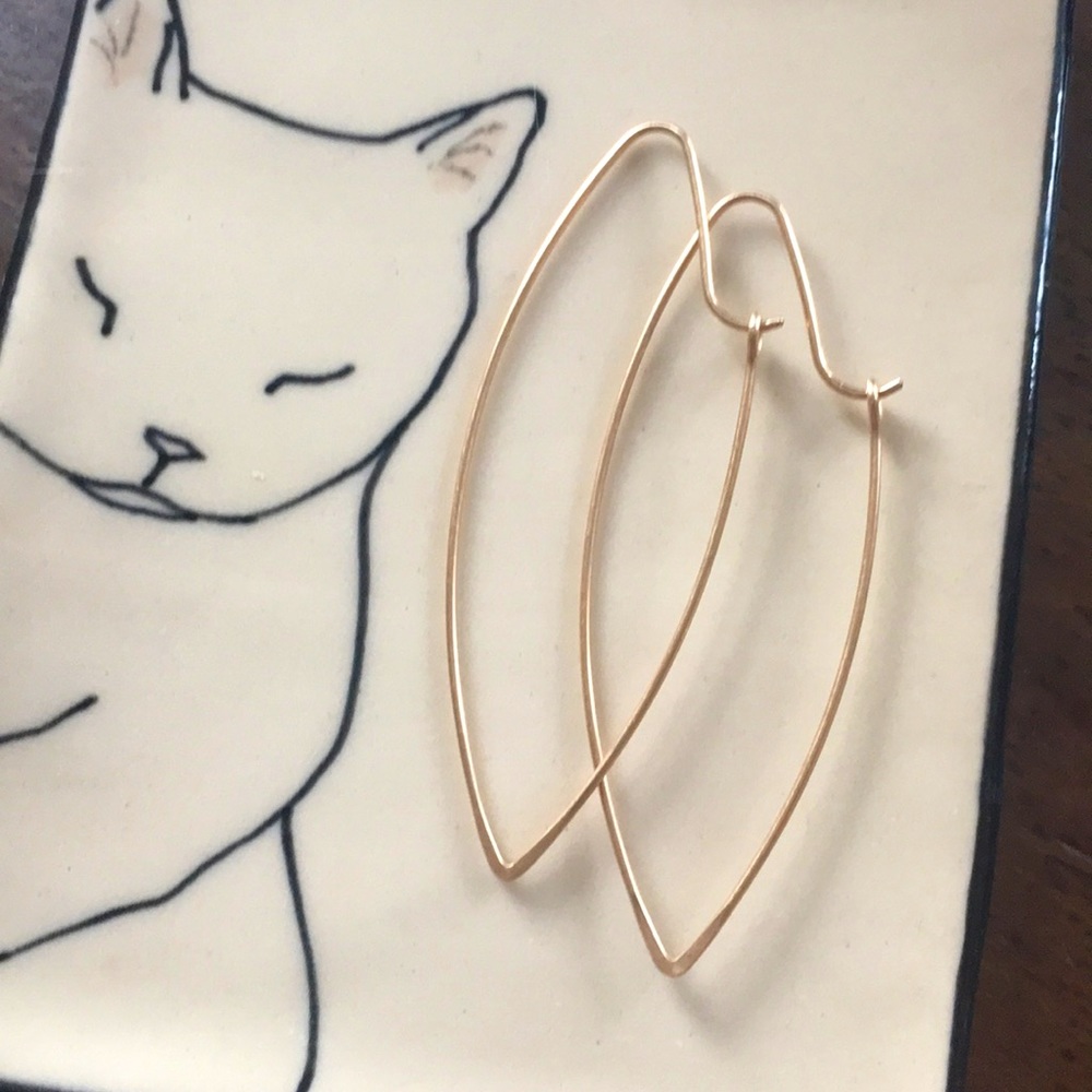 Gold earrings.